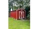 Exterior view of a red shed with white trim at 214 Four Iron Dr, Summerville, SC 29483
