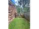 Sideyard fenced with a gate and brick exterior at 214 Four Iron Dr, Summerville, SC 29483
