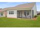 Home featuring a screened in back porch and backyard views at 220 Garden Gate Way, Summerville, SC 29486
