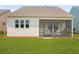 Home featuring a screened in back porch and backyard views at 220 Garden Gate Way, Summerville, SC 29486