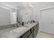 Bathroom featuring double sinks with granite counters, tile flooring, white doors, and walk-in shower at 220 Garden Gate Way, Summerville, SC 29486