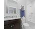Neutral bathroom with granite countertops, stainless steel fixtures, white tiling and dark vanity at 220 Garden Gate Way, Summerville, SC 29486