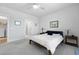 Cozy bedroom with light gray carpet, modern fan and ensuite bathroom and laundry at 220 Garden Gate Way, Summerville, SC 29486