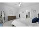 Bedroom with light gray carpet, ceiling fan, gray walls, ensuite bathroom and wood dresser at 220 Garden Gate Way, Summerville, SC 29486