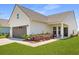 Charming home with a two-car garage, a covered front porch, and tasteful landscaping at 220 Garden Gate Way, Summerville, SC 29486