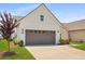 Beautiful home showcasing a spacious driveway, neat lawn, and a two-car garage for convenience at 220 Garden Gate Way, Summerville, SC 29486