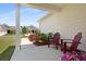Cozy front porch with two chairs and colorful flowers, perfect for relaxing and enjoying the view at 220 Garden Gate Way, Summerville, SC 29486