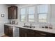 Bright kitchen with granite countertops, stainless steel appliances, and generous cabinet space at 220 Garden Gate Way, Summerville, SC 29486