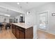 Kitchen island boasts ample storage, granite countertops, and a view of the living area at 220 Garden Gate Way, Summerville, SC 29486