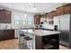 Well-equipped kitchen boasts granite countertops, stainless steel appliances, and an island with seating at 220 Garden Gate Way, Summerville, SC 29486
