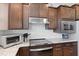 Updated kitchen features granite countertops, stainless steel appliances, and modern finishes at 220 Garden Gate Way, Summerville, SC 29486