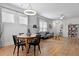 Open-concept living and dining area with modern lighting, wood floors, and stylish decor at 220 Garden Gate Way, Summerville, SC 29486