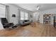Bright living room features modern furnishings, natural light, and wood-look flooring at 220 Garden Gate Way, Summerville, SC 29486