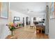 Open-concept living room with hardwood floors and modern decor featuring a neutral color palette at 220 Garden Gate Way, Summerville, SC 29486