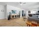 Bright living room features an open floorplan with hardwood floors and neutral paint at 220 Garden Gate Way, Summerville, SC 29486