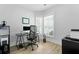 Well-lit office space with hardwood flooring, a large window, modern desk and decor at 220 Garden Gate Way, Summerville, SC 29486