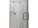 Walk-in shower featuring white subway tile and a glass door with chrome shower head at 220 Garden Gate Way, Summerville, SC 29486