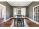 Inviting dining room with hardwood floors, two windows, and neutral wall color at 222 E Main St, Moncks Corner, SC 29461