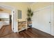 Hallway features storage shelves with baskets, wood flooring, and a view of the kitchen at 222 E Main St, Moncks Corner, SC 29461