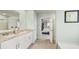 Bright bathroom features granite countertops, double sinks, and views into the bedroom and walk-in closet at 225 Wild Strawberry Ln, Moncks Corner, SC 29461