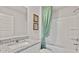 Modern bathroom featuring granite countertops, a sink, and a tub with shower, combining style with convenience at 225 Wild Strawberry Ln, Moncks Corner, SC 29461