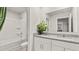 Bright bathroom with granite counters, dual sinks, a shower-tub combo, and a clean, modern aesthetic at 225 Wild Strawberry Ln, Moncks Corner, SC 29461