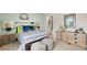 Cozy bedroom with a coastal theme, featuring a comfortable bed, nautical decor, and soft, inviting textures at 225 Wild Strawberry Ln, Moncks Corner, SC 29461