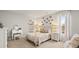 Charming bedroom with soft carpet, decorated with butterfly accents, and a cozy sitting area for relaxation at 225 Wild Strawberry Ln, Moncks Corner, SC 29461