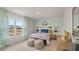 Charming bedroom features a cozy bed, bright window, and whimsical decor that brings a playful ambiance to the space at 225 Wild Strawberry Ln, Moncks Corner, SC 29461