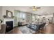 Inviting living room featuring a fireplace, ceiling fan, plush seating, and hardwood floors at 225 Wild Strawberry Ln, Moncks Corner, SC 29461