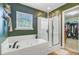 Bathroom offers a soaking tub, stand up shower and access to a walk-in closet at 230 Sweet Alyssum Dr, Ladson, SC 29456