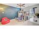bedroom featuring a bunk bed with a workspace underneath and a unique space-themed wall art at 230 Sweet Alyssum Dr, Ladson, SC 29456