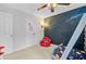 Cozy room with a unique space-themed wall art, a bunk bed, and a comfortable red beanbag chair at 230 Sweet Alyssum Dr, Ladson, SC 29456