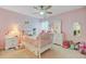 Charming bedroom with whimsical decor, carpeted floor, and plenty of play space at 230 Sweet Alyssum Dr, Ladson, SC 29456