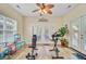 A bonus room with fitness equipment, ceiling fan, and access to the backyard at 230 Sweet Alyssum Dr, Ladson, SC 29456