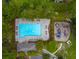 Birds-eye view of community pool and playground, complete with ample seating and mature trees at 230 Sweet Alyssum Dr, Ladson, SC 29456