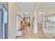 Bright foyer featuring wood flooring, stylish decor, and an open layout leading to multiple living spaces at 230 Sweet Alyssum Dr, Ladson, SC 29456