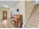 A foyer with a piano, staircase, and decorative lighting fixture at 230 Sweet Alyssum Dr, Ladson, SC 29456