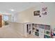 Upstairs hallway with built-in shelving and a desk area by the window, offering versatile living space at 230 Sweet Alyssum Dr, Ladson, SC 29456