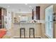 Modern kitchen featuring dark cabinets, stainless steel appliances, and a breakfast bar at 230 Sweet Alyssum Dr, Ladson, SC 29456