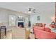 Inviting living room featuring a fireplace, plush seating, and a ceiling fan at 230 Sweet Alyssum Dr, Ladson, SC 29456