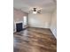 Open living room with a fireplace and ceiling fan, showcasing the home's interior at 230 Sweet Alyssum Dr, Ladson, SC 29456