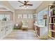 Cozy office space with wood flooring, built-in bookshelves, a comfortable chair, and natural light at 230 Sweet Alyssum Dr, Ladson, SC 29456