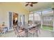 Screened-in porch with outdoor dining set, offering a relaxing space for entertaining at 230 Sweet Alyssum Dr, Ladson, SC 29456