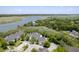 An aerial view of homes nestled among lush greenery along the serene waterway at 2333 Tall Sail Dr # G 607, Charleston, SC 29414