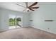 Bright bedroom features a vaulted ceiling, balcony, and large windows with lots of natural light at 2333 Tall Sail Dr # G 607, Charleston, SC 29414