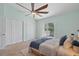 Bedroom featuring large closets, access to a private balcony, and a ceiling fan at 2333 Tall Sail Dr # G 607, Charleston, SC 29414