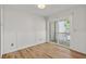 Bedroom with wood floors, wainscoting and sliding glass doors leading to the outside at 2333 Tall Sail Dr # G 607, Charleston, SC 29414