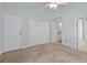 An open and airy bedroom is enhanced by light-colored walls and multiple access doors at 2333 Tall Sail Dr # G 607, Charleston, SC 29414