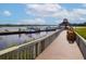 A wooden community dock provides a picturesque view, creating a tranquil spot for relaxation and enjoying the scenery at 2333 Tall Sail Dr # G 607, Charleston, SC 29414